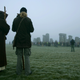 Wiccan worshippers stand near the ancient stone monument of Stonehenge in the UK.